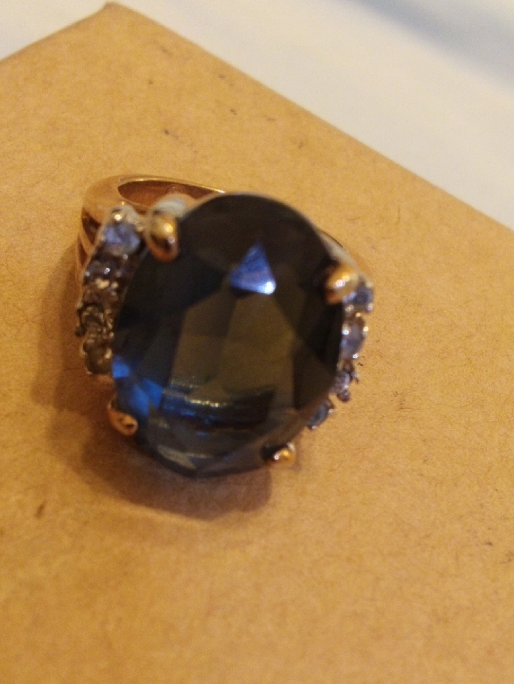 Gold-Tone Ring with Large Dark Blue Oval Stone